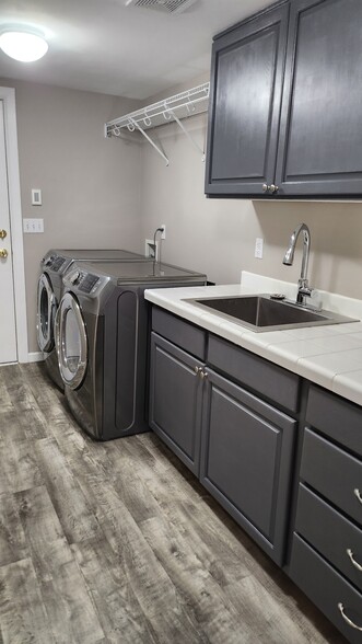 Laundry room/mud room connects to garage and has utility sink - 7409 245th Way NE