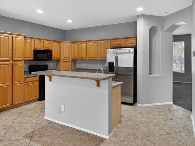 Building Photo - Single-level 4 bed, 2 bath home with tandem 3-car garage and RV gate.
