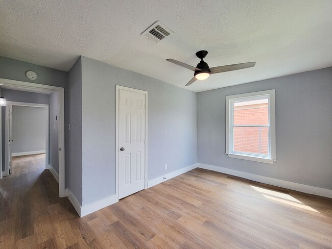 Building Photo - This beautifully updated 4-bedroom home is just under two miles from Highway 288 and Loop 610, ma...