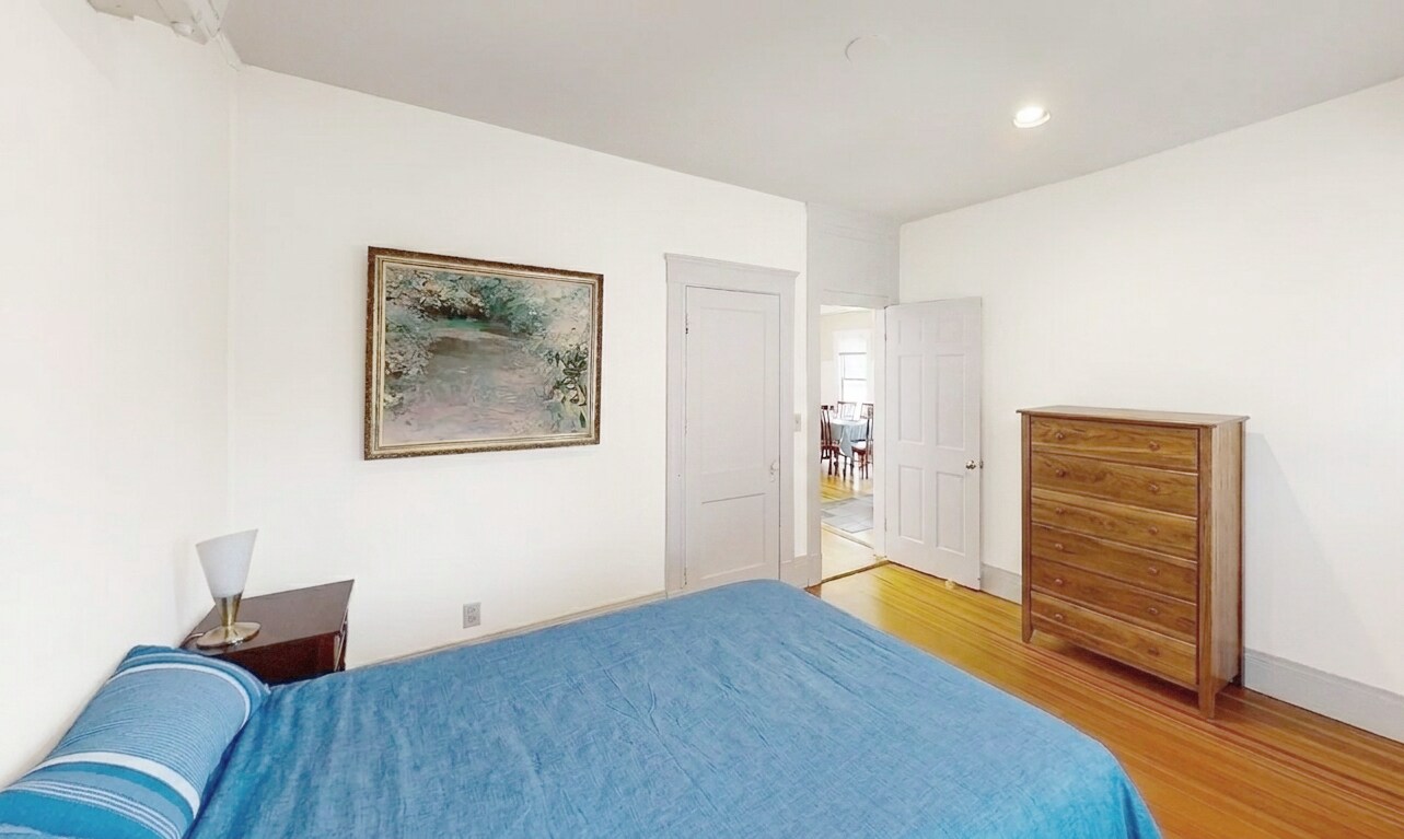 Bedroom #1 with closet, two windows and connected front porch. - 307 Tappan St