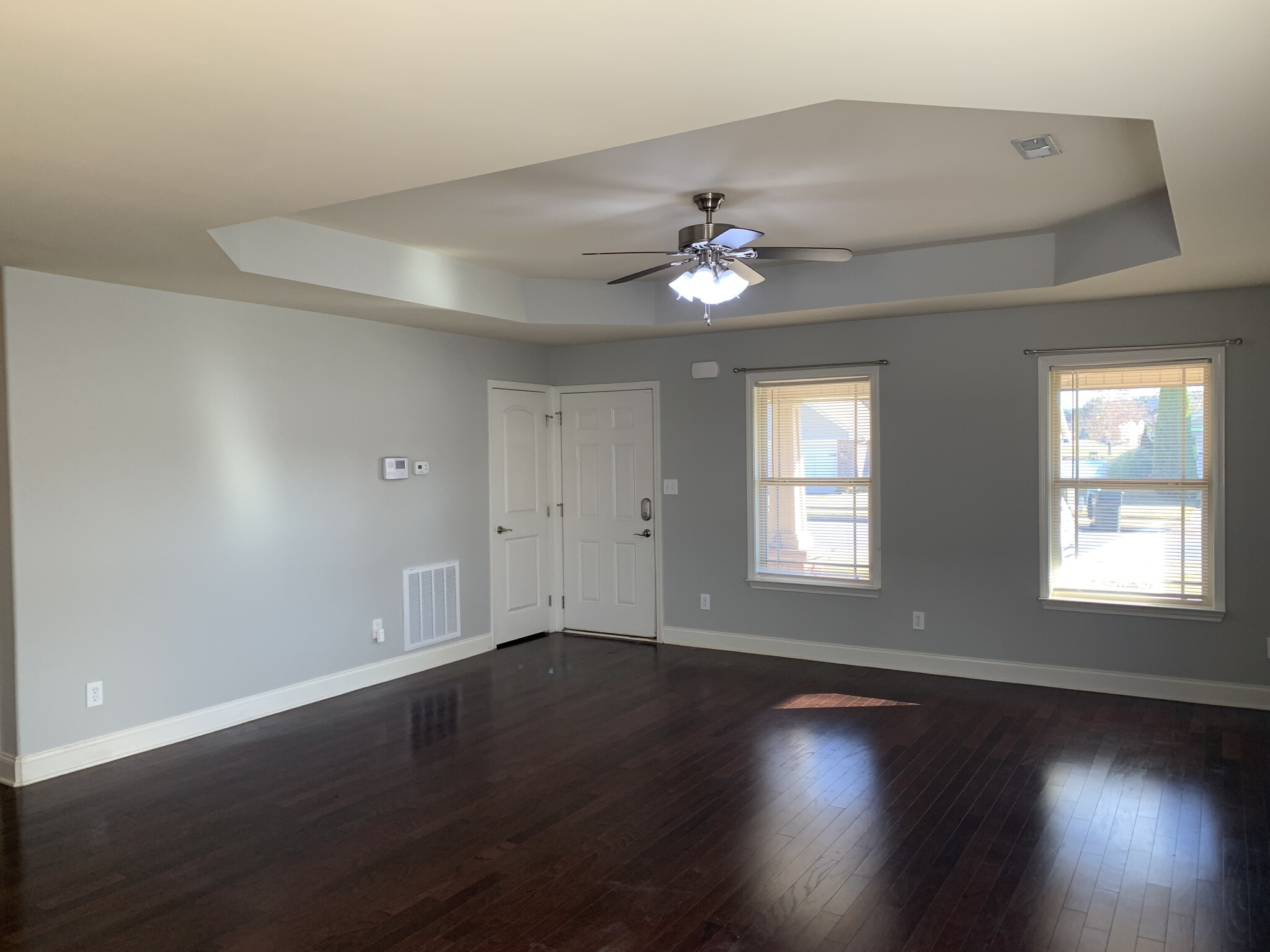 Spacious open living room with tray ceilings - 253 Village Springs Dr