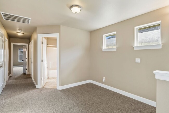 Building Photo - Spacious 4-Bedroom Home with New Paint & Carpet, Fenced Yard
