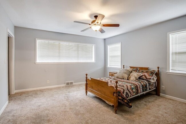 Building Photo - Spacious 4-Bedroom Home with Dual Living Areas