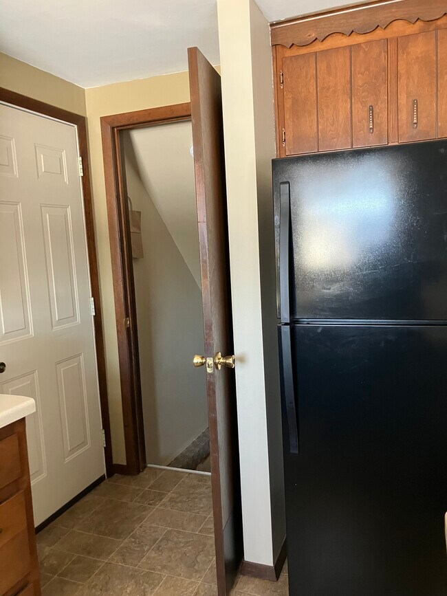 Door to garage and basement from the kitchen. - 1525 Commanche Ave