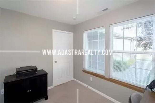 Building Photo - Spacious Maintenance Free Townhome in Gard...