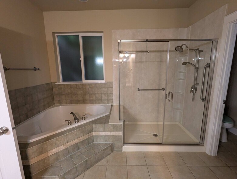 Primary shower and soaking tub - 9535 Piperhill Dr SE