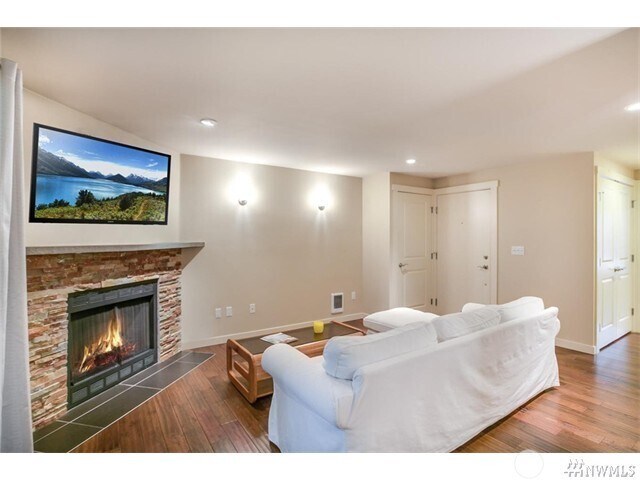 Spacious Living Room W/High End Hardwood Flooring and a Cozy Fireplace - 15140 NE 82nd St