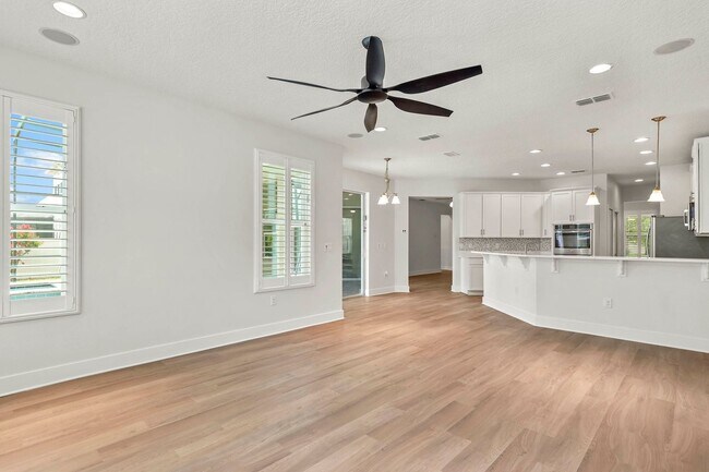 Building Photo - Expansive 4 bedroom, 3 bath remodeled home in gated community