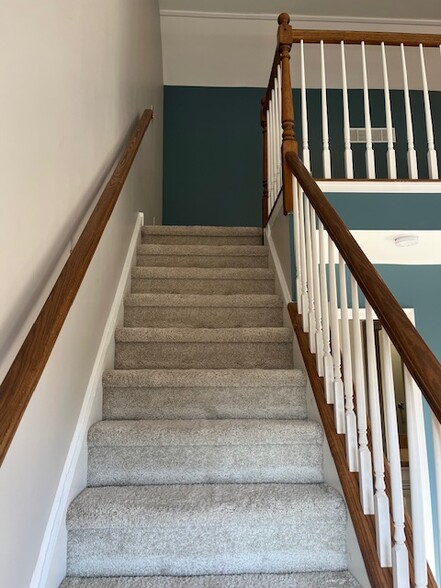 Master bedroom stairs up to loft - 5534 Rinker Cir