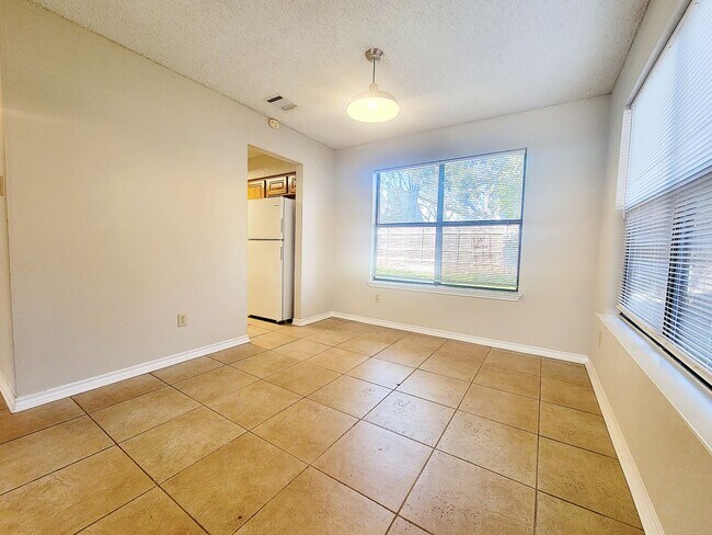 Building Photo - Warm & Inviting 4BR / 2.5BA Home with Covered Deck and 2-Car Garage