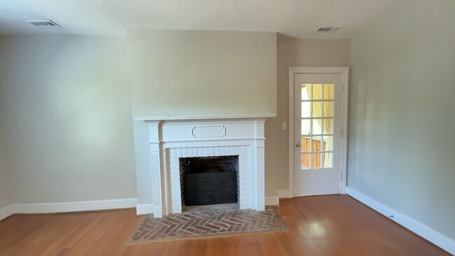 Building Photo - Charming 2BR with Sunroom, Hardwood Floors & Lawn Care Included