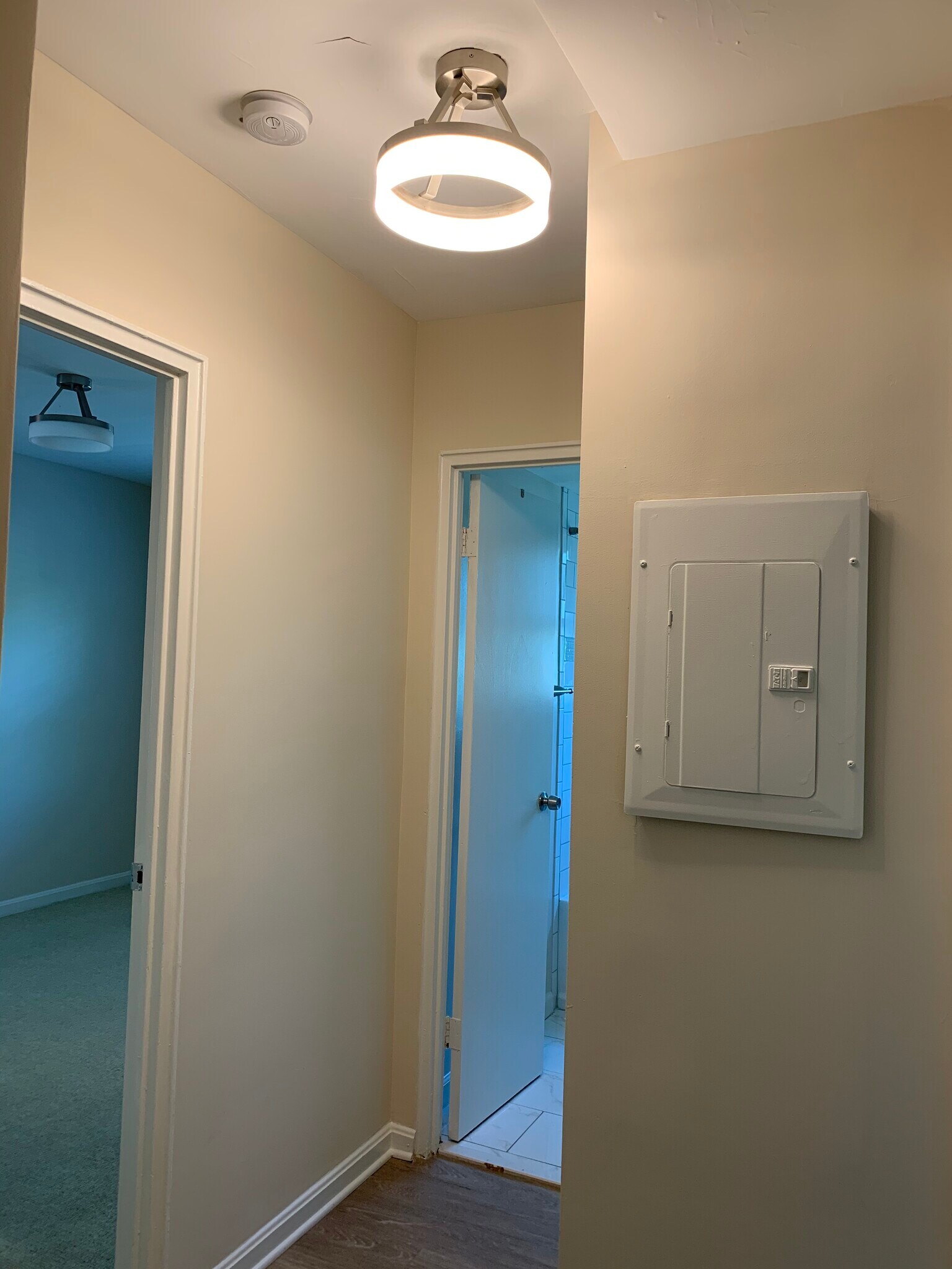 Hallway. Bedroom one is the door on the left and the Bathroom is the door on the right. - 526 Kenyon Street NW #101