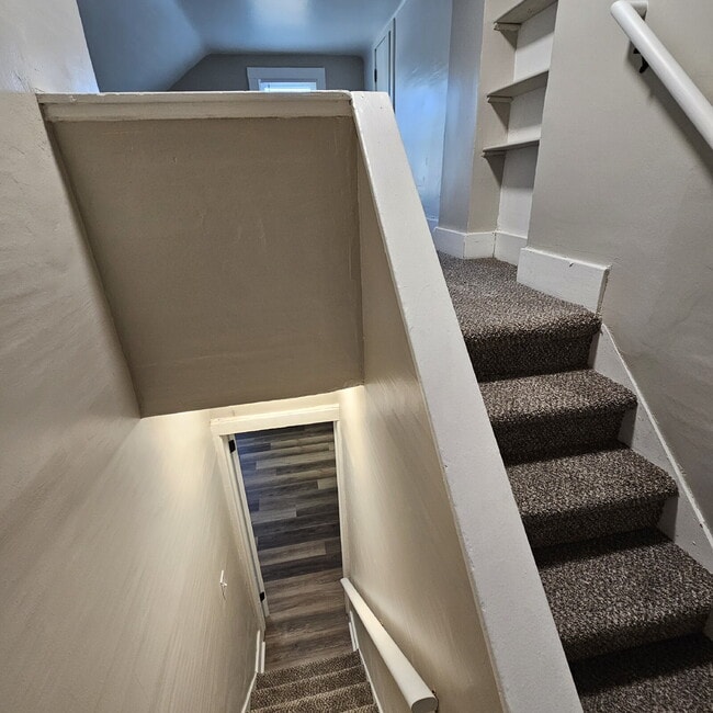 Building Photo - Duplex - 2 Bedroom Completely Remodeled Living Space with New Laminate Flooring on Main Floor alo...