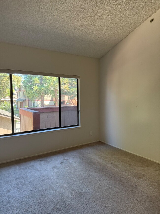 Building Photo - Spacious 3-Bedroom, 2-Bath Multi-Level Home with Balcony, In-Unit Laundry & Dual Parking