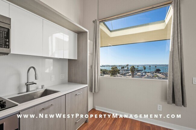 Building Photo - Views, Views, Views! Stunning Top-Floor Little Italy 2-bedroom Loft at The Waterfront!