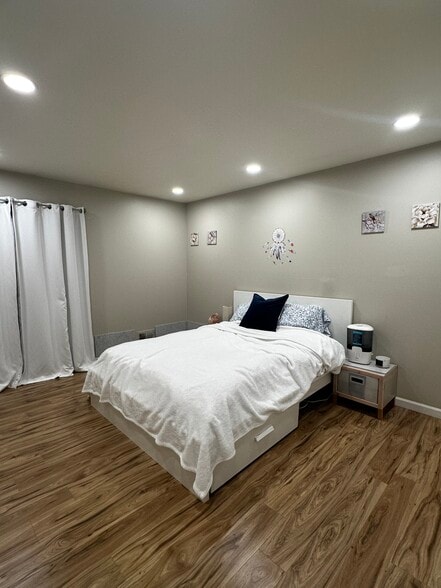 bedroom, updated laminated flooring - 12054 15 Mile Rd