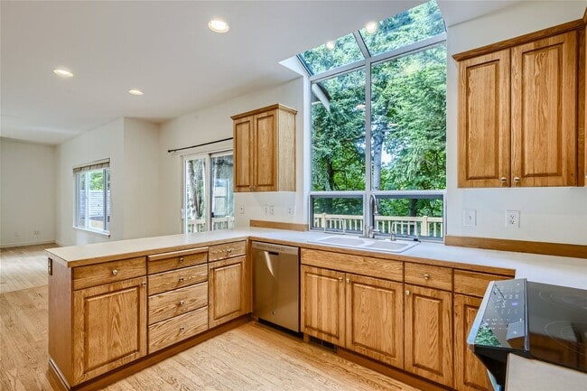 Building Photo - Spacious 4-Bedroom Home in Kenmore | Private Greenbelt Setting + Landscaping Included