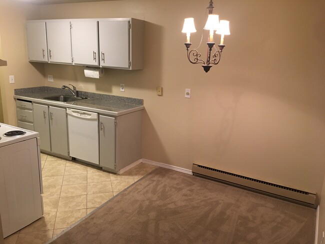 Kitchen with Granite counter tiles - 19411 56th Ave W