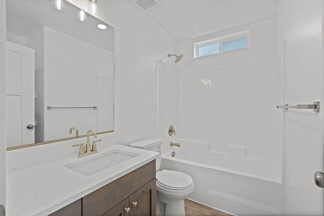 Building Photo - NEW HOME with large garage stalls and unfinished basement for additional storage