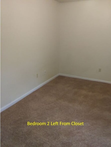 Bedroom 2 looking from closet to the left. Door is far left. - 7933 Bles Ave