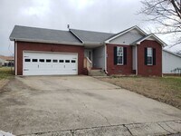 Building Photo - Close to Post! No Carpet! Lovely 3 Bed/2 Bath fenced in backyard!