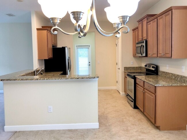 Building Photo - Beautiful 3/2 Spacious Home with a Covered...