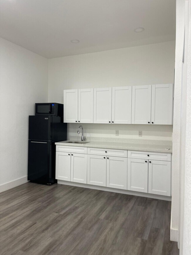 Kitchen with fridge, micro and storage space - 22916 SW 115th Ave