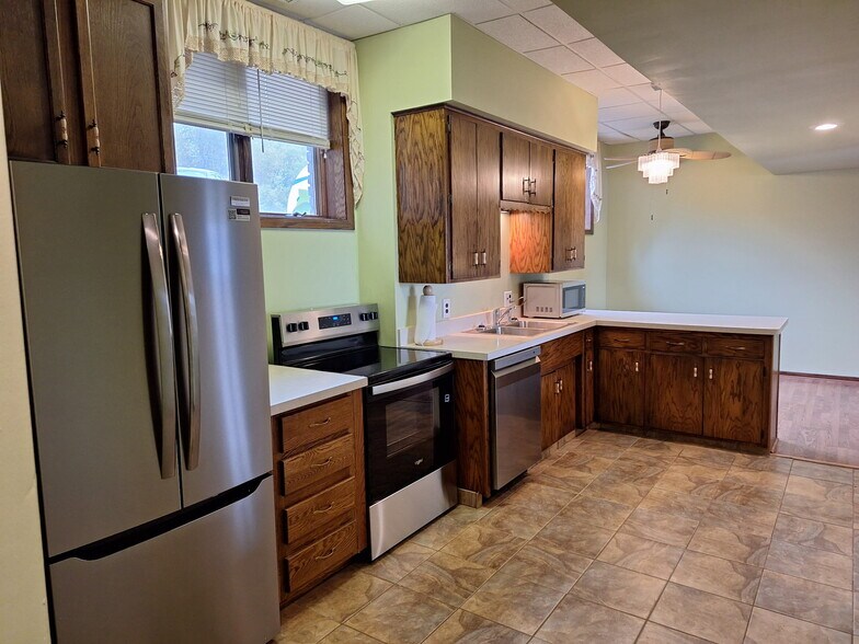Kitchen from connecting room - 9199 Jane Rd N