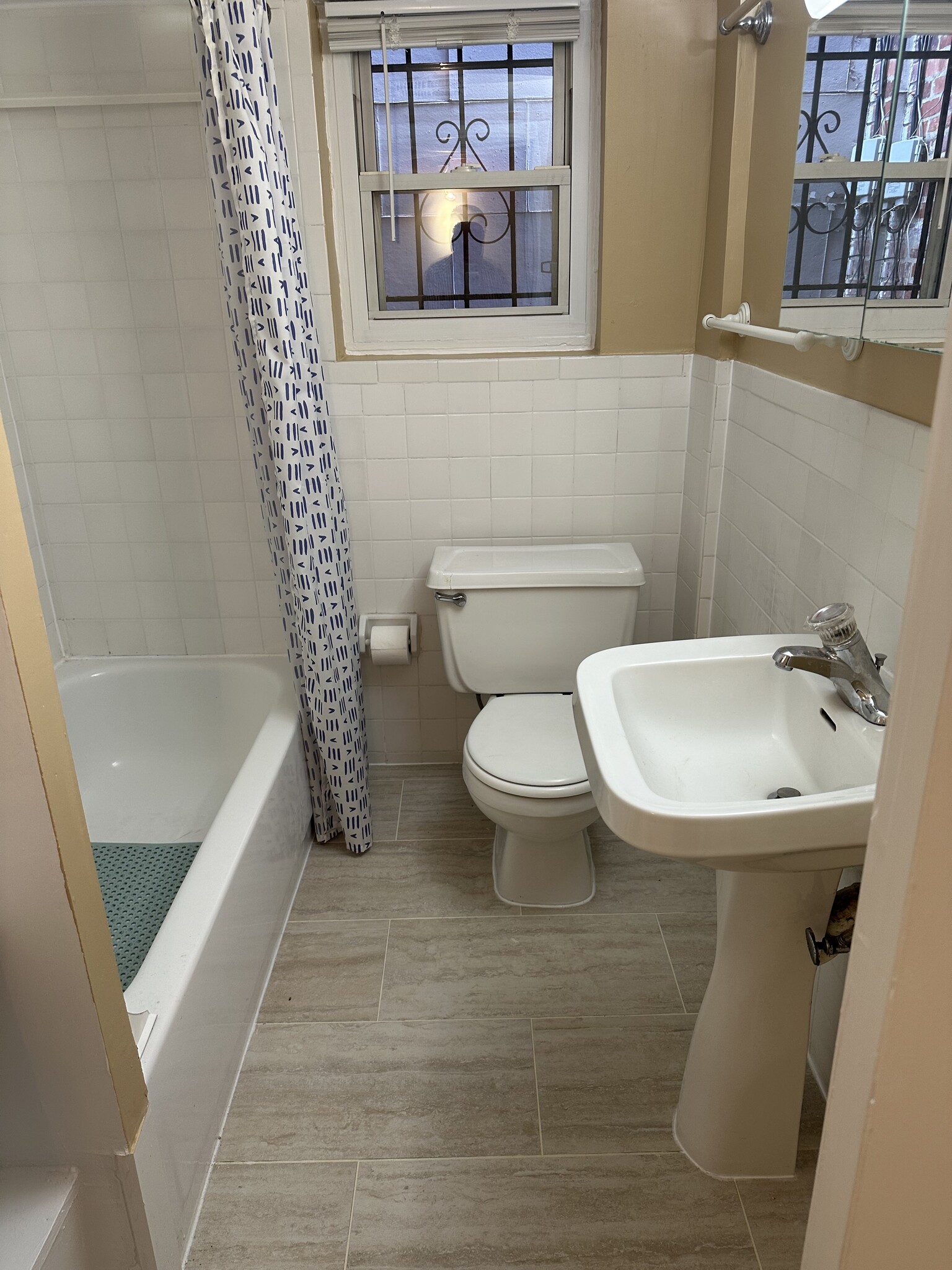 Bath without rug to expose new porcelain tiled floor - 1336 Kenyon St NW