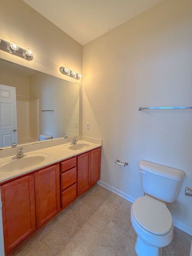 Building Photo - Beautifully updated Townhome! New cabinets, granite counter tops, and LVP flooring through downst...