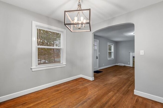 Building Photo - Brick home, Two Story, Hardwoods, DR, 2 Sun Rooms, FP, Carport!.