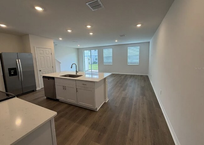 Building Photo - "Spacious 3-Bedroom Townhouse with Granite Elegance in St. Cloud – 4543 Rangeland Way"