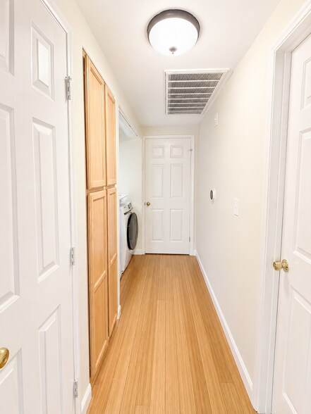 Hallway and laundry nook - 9580 W Reno Ave