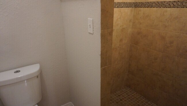 Building Photo - Four Bed - Three Bath - Large Storage Area...