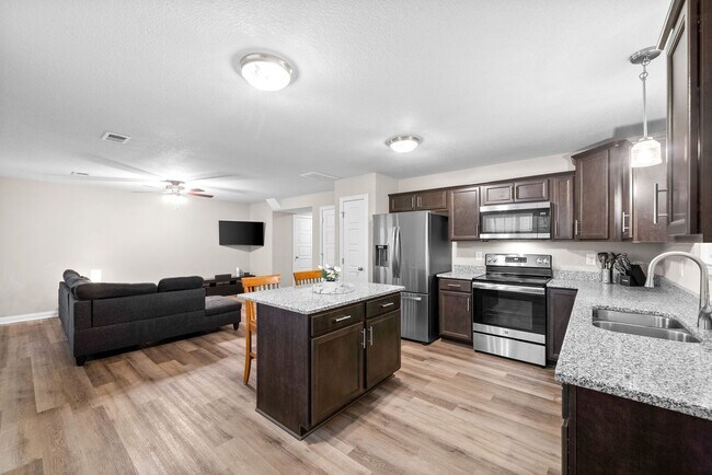 Building Photo - Stocked Pond, Walking Trails and More!!