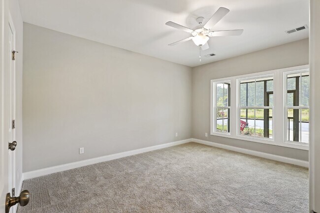 Building Photo - Spacious townhome with a wooded view! Spec...