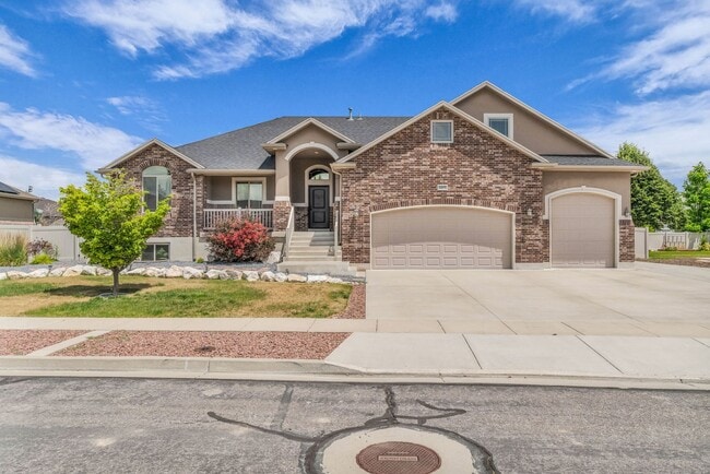 Building Photo - Spacious Syracuse Home with Covered Deck, Loft & Oversized 3-Car Garage