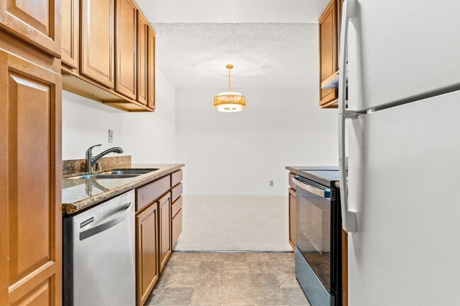 Building Photo - Modern 2-Bedroom Condo with Pool and Koi Pond Views