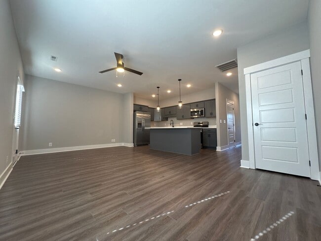 Building Photo - “Stylish 3BR End-Unit | Open Concept | Quartz Kitchen | Garage + Deck