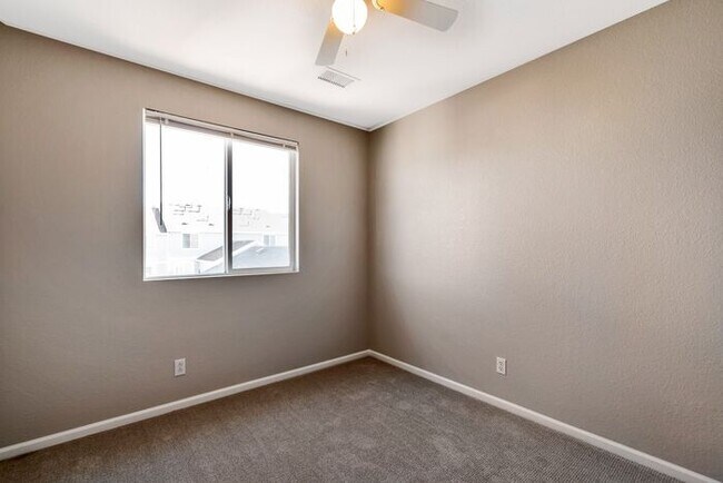 Building Photo - 3BR Townhome Near DIA & Light Rail | New Carpet, Garage & Fenced Patio