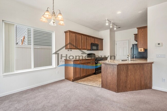 Building Photo - Townhouse Style Home with 3 Bedrooms, 2.5 Bathrooms, and a 2-Car Attached Garage Available in Coe...