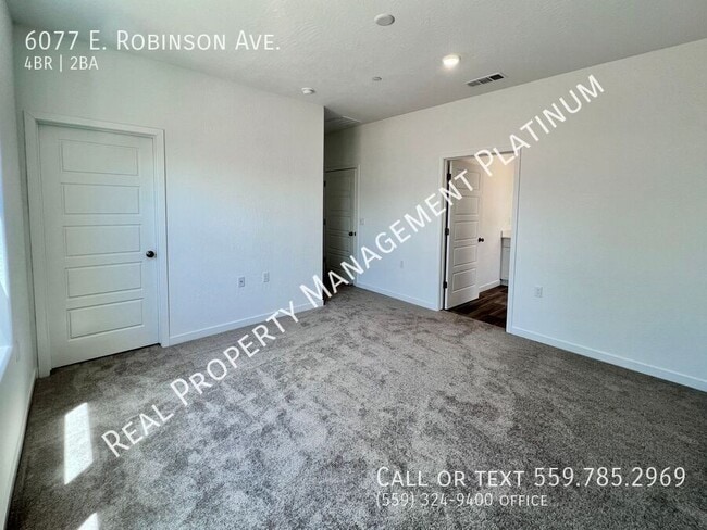 Building Photo - 6077 E Robinson Ave
