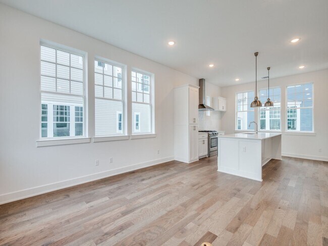 Building Photo - Welcome to a beautiful Craftsman-style end...