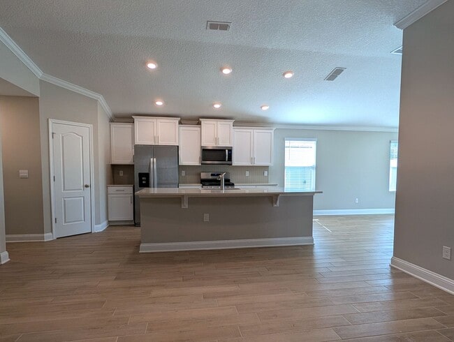 Building Photo - PREMIUM PRICE, PREMIUM FINISHES AND FULLY FENCED REAR YARD - THIS 3/2/2 IN THE DESIRABLE GATED DO...