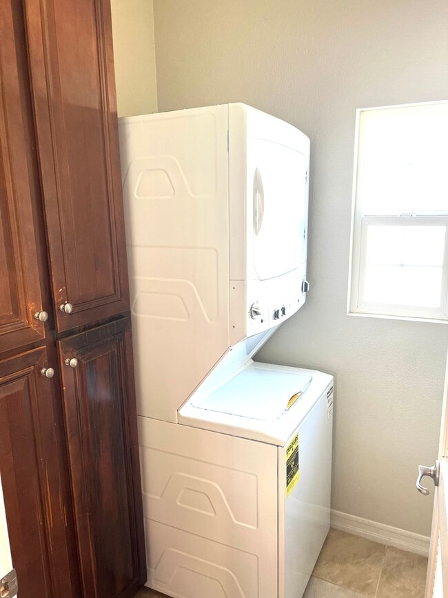 New washer & dryer - full sized stackable - 10545 Zenor Ln