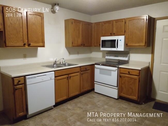 Building Photo - Two Bedroom 1.5 bath unit for rent