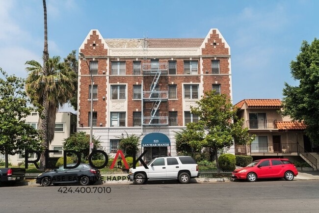 Building Photo - Stylish Studio with Exposed Red Brick, Sta...