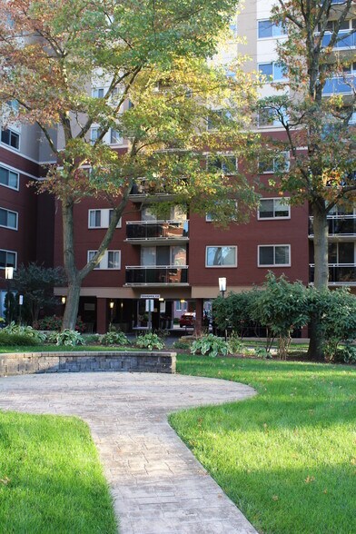 View of balcony hidden in foliage - 7333 New Hampshire Ave