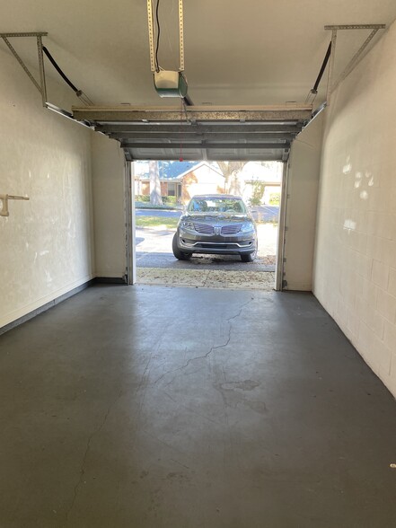 Exclusive and private single-car garage comes with a remote clicker. - 13200 W Newberry Rd