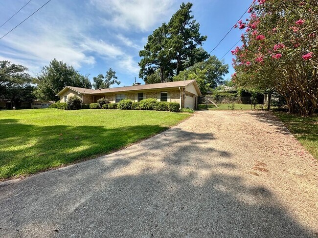Building Photo - Spacious 4-Bedroom Home on a Corner Lot wi...